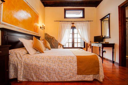 Twin room del hotel Hotel Rural Jardines de Milano - Adults Only. Foto 12