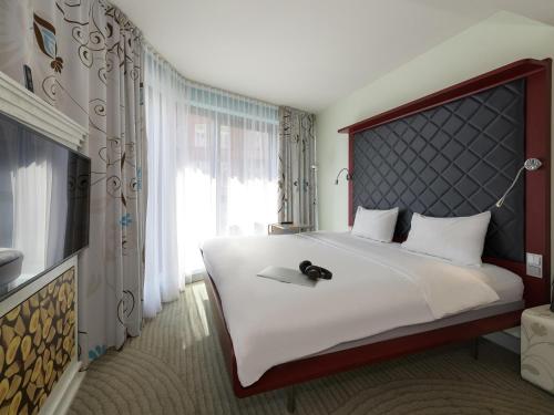 Habitación estándar con una cama doble del hotel Ibis Styles Berlin Mitte. Foto 3