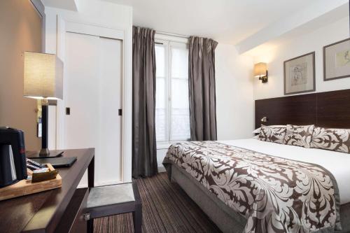 Habitación Deluxe del hotel Paris Louvre Opéra. Foto 4