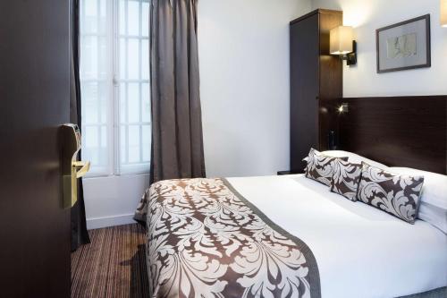 Habitación Clásica del hotel Paris Louvre Opéra. Foto 6