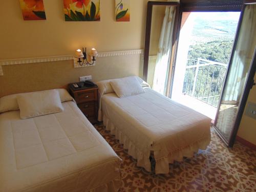 Habitación Doble con baño privado - 2 camas del hotel Sierra De Araceli. Foto 18