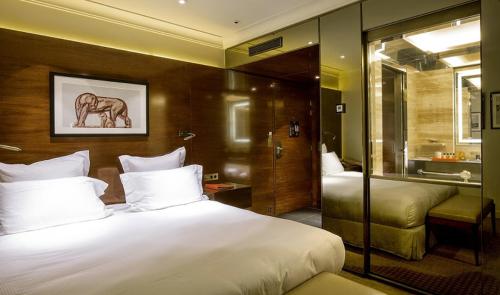 Habitación Doble Deluxe del hotel Montaigne. Foto 3