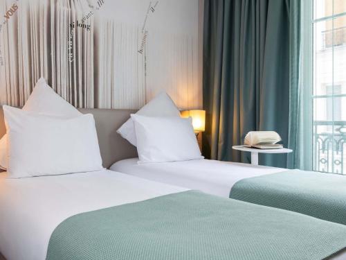 Habitación Doble Clásica - 2 camas del hotel Mercure Paris Montparnasse Raspail. Foto 3