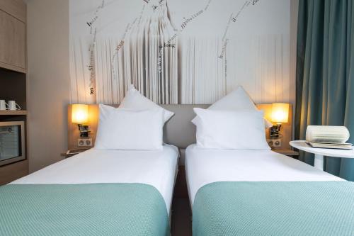 Habitación Doble Clásica - 2 camas del hotel Mercure Paris Montparnasse Raspail. Foto 6