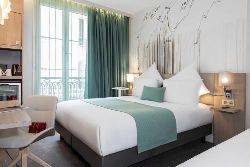 Habitación Doble Privilege con sofá cama del hotel Mercure Paris Montparnasse Raspail. Foto 6