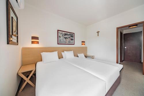 Habitación Doble con cama supletoria - 2 camas del hotel Crisol Tres Pastorinhos