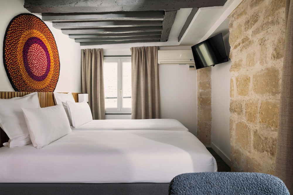 Habitación con 2 camas individuales del hotel Louvre Marsollier Opéra