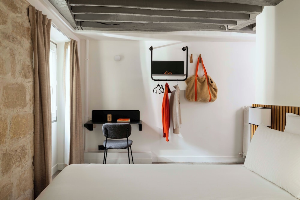 Habitación con 2 camas individuales del hotel Louvre Marsollier Opéra. Foto 1