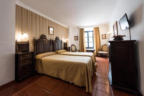 Habitación Triple del hotel Soho Boutique Palacio San Gabriel. Foto 1