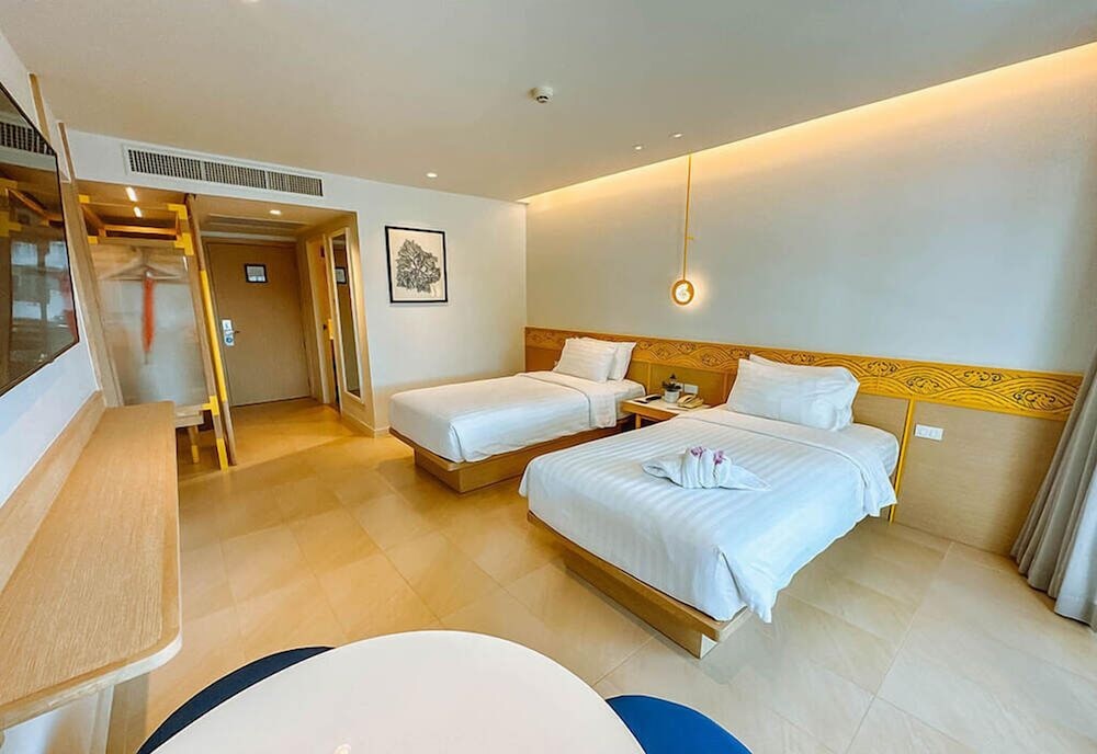 Habitación Deluxe 2 Camas Individuales, Vistas al Jardín del hotel Novotel Rayong Rim Pae Resort. Foto 1