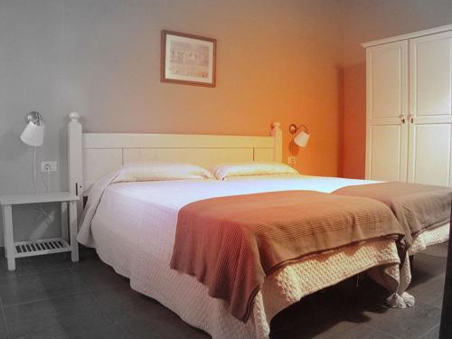 Apartamento 2 habitaciones 4 camas individuales del hotel Alojamientos El Tejado. Foto 2