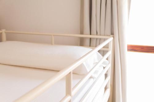 Cama en habitación femenina compartida de 4 camas del hotel Casa Grande Surf. Foto 6