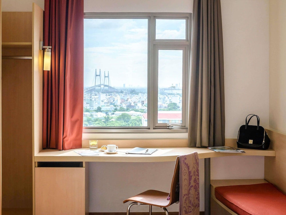Habitación estándar con dos camas individuales del hotel Ibis Saigon South. Foto 9