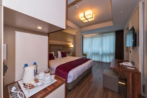 Habitación Triple Deluxe del hotel Golden Royal and Spa. Foto 11