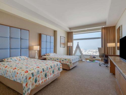 Habitación Familiar del hotel Swissotel Al Ghurair. Foto 3