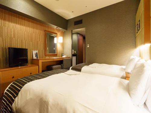 Habitación Doble - No fumadores - 2 camas del hotel Sotetsu Fresa Inn Higashi Shinjuku. Foto 3