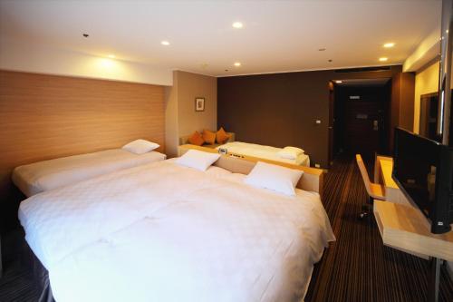 Habitación Cuádruple Estándar - No fumadores del hotel Grand Prince Hotel Shin Takanawa. Foto 4