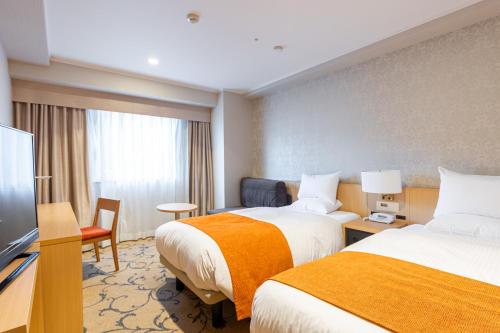 Habitación Doble Deluxe para no fumadores - 2 camas individuales del hotel Rose Garden Shinjuku