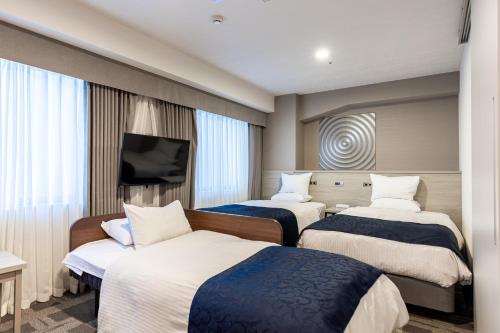 Habitación Triple Superior con cama supletoria - No fumadores del hotel Rose Garden Shinjuku