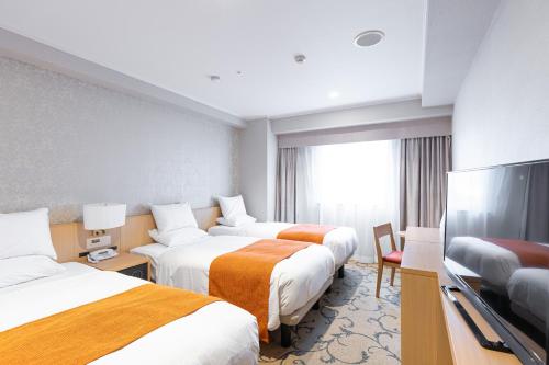 Habitación Triple Deluxe para no fumadores del hotel Rose Garden Shinjuku