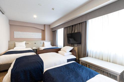 Habitación Cuádruple Superior con 2 camas supletorias - No fumadores del hotel Rose Garden Shinjuku