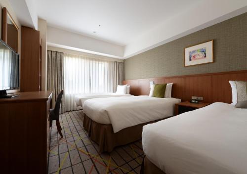Habitación Doble Estándar con cama supletoria - No fumadores - 2 camas del hotel Metropolitan Tokyo Ikebukuro