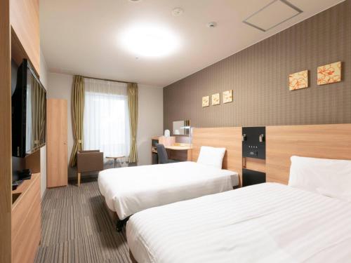 Habitación doble Económica 2 Camas individuales Normal del hotel Comfort Osaka Shinsaibashi. Foto 1