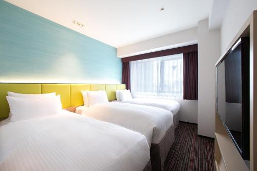 Habitación Doble Estándar con cama supletoria - No fumadores - 2 camas del hotel Holiday Inn Osaka Namba. Foto 7