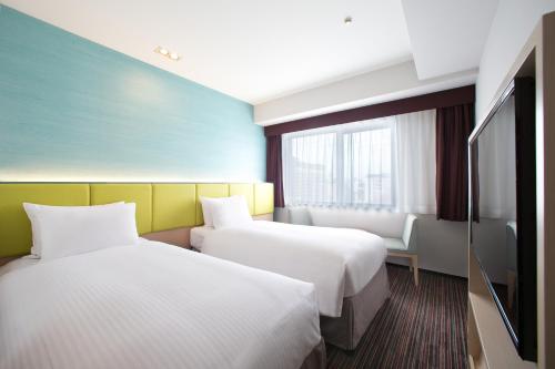 Habitación Doble Estándar - 2 camas - No fumadores del hotel Holiday Inn Osaka Namba. Foto 7