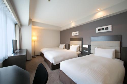 Habitación Doble Superior para no fumadores con cama supletoria - 2 camas del hotel Holiday Inn Osaka Namba. Foto 7
