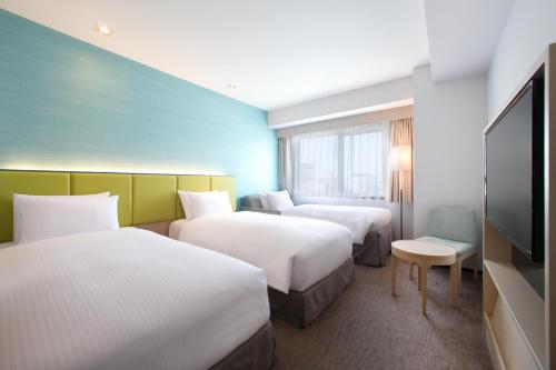 Habitación Doble Superior para no fumadores con cama supletoria - 2 camas del hotel Holiday Inn Osaka Namba. Foto 8