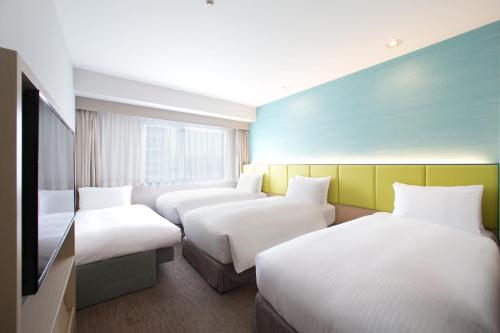 Habitación Cuádruple Económica - No fumadores del hotel Holiday Inn Osaka Namba. Foto 7