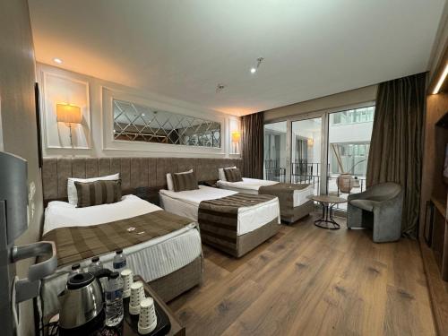 Habitación Triple Estándar con vistas al atrio del hotel The Beyaz Saray and Spa. Foto 6