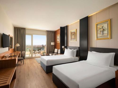 Habitación Executive - 2 camas del hotel Movenpick Cairo Media City. Foto 1