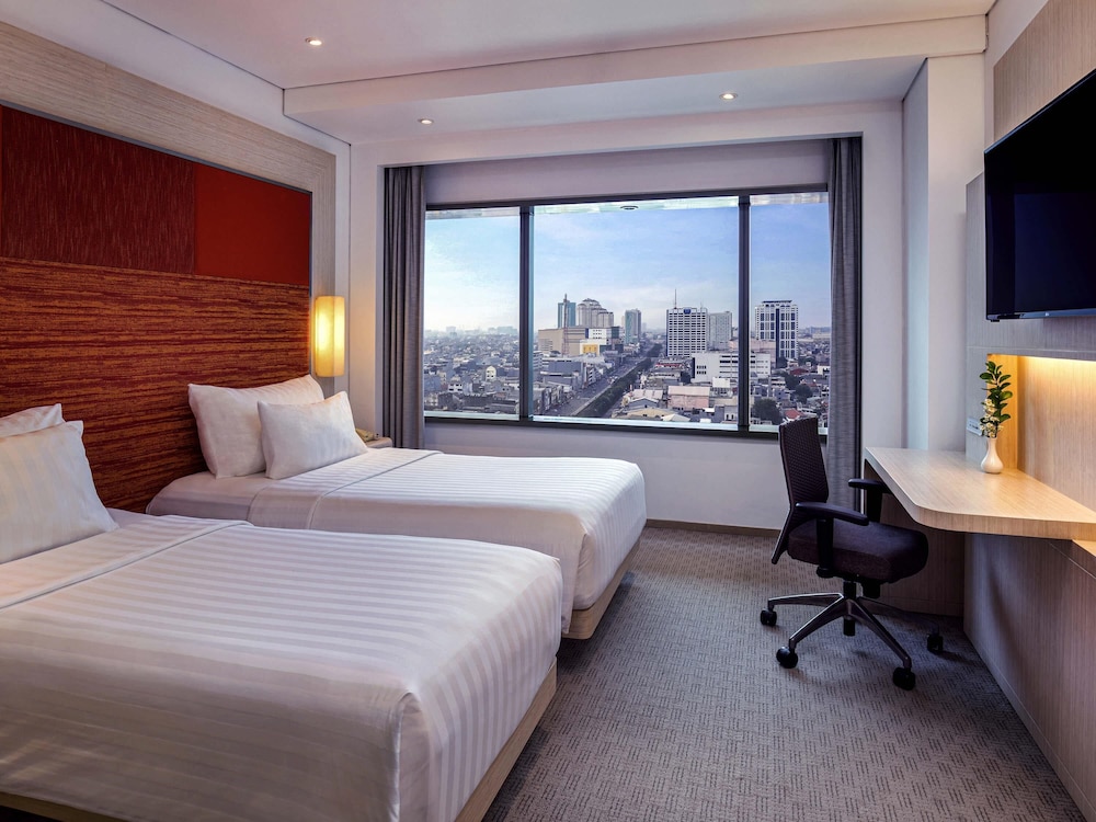 Habitación superior con 2 camas individuales del hotel Grand Mercure Jakarta Harmoni