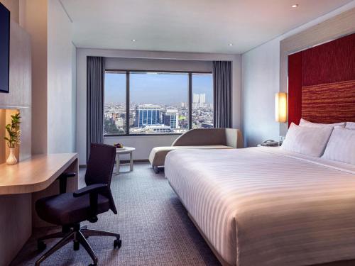 Grand Deluxe con 2 Camas Individuales del hotel Grand Mercure Jakarta Harmoni. Foto 1