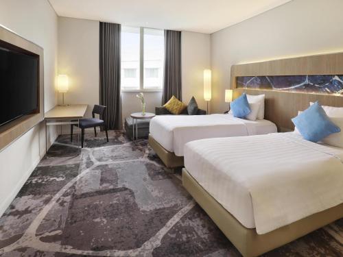Habitación Deluxe Piso Premier 2 Camas Individuales del hotel Novotel Jakarta Mangga Dua Square