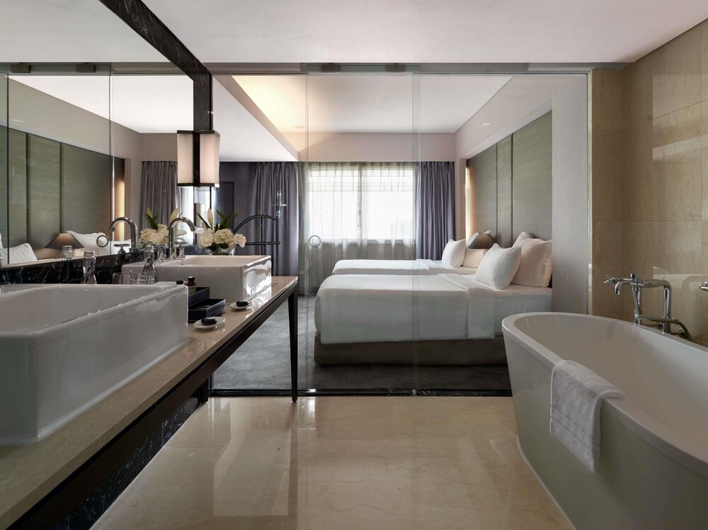Habitación Deluxe, 2 camas individuales del hotel Pullman Jakarta Indonesia. Foto 1