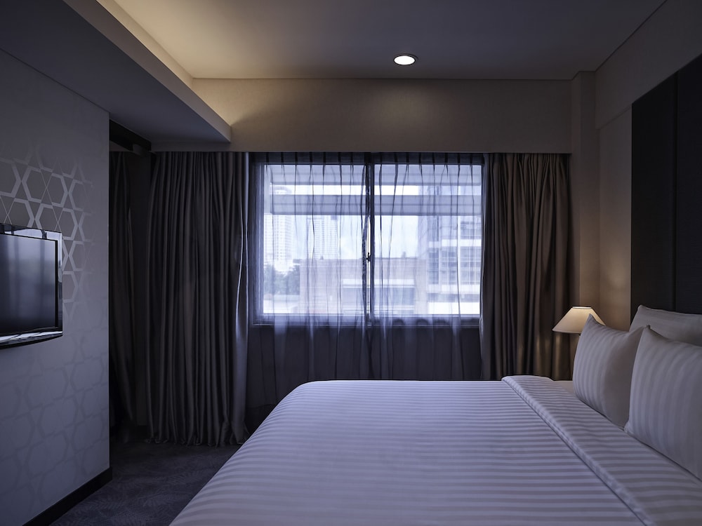 Habitación superior, 1 cama de matrimonio, vistas a la ciudad (Premium) del hotel Pullman Jakarta Indonesia. Foto 1
