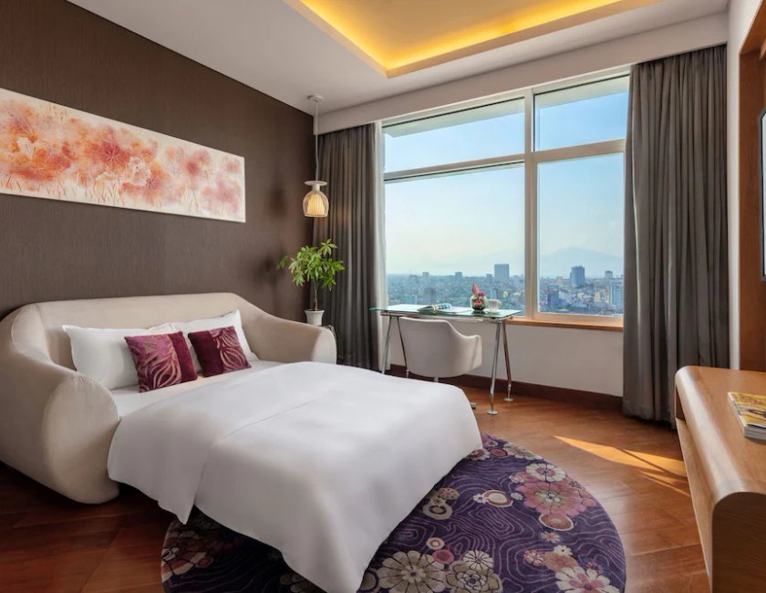 Suite Vista Rio 1 Cama king Familiar Privilege 1 Cama Individual del hotel Grand Mercure Danang. Foto 1