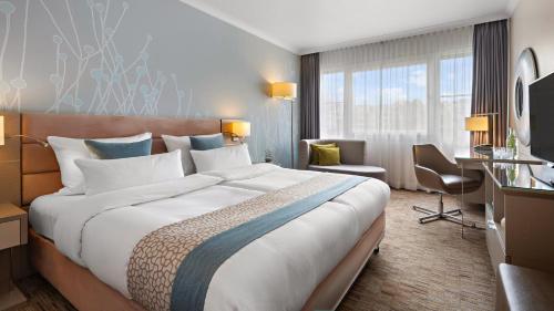 Habitación Estándar - 1 cama extragrande - Planta media del hotel Crowne Plaza Berlin City Centre, An Ihg. Foto 1