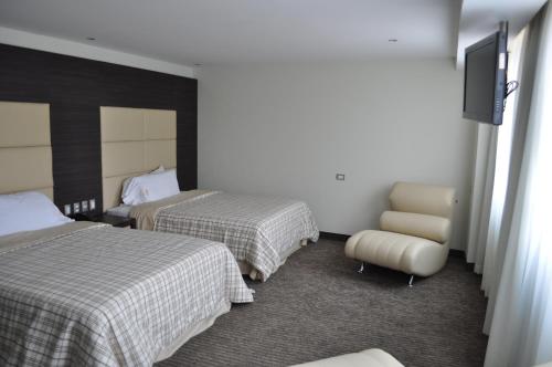Habitación con 2 camas grandes del hotel Astor. Foto 5