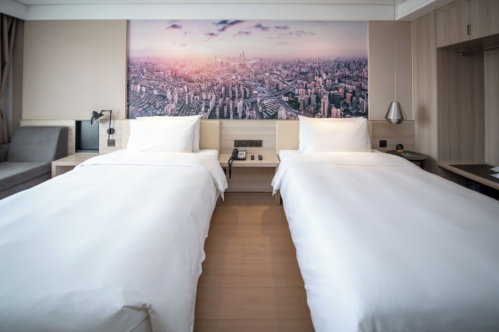 Habitación Deluxe, 2 camas individuales del hotel Mercure Shanghai Pudong Zhangjiang Park. Foto 1