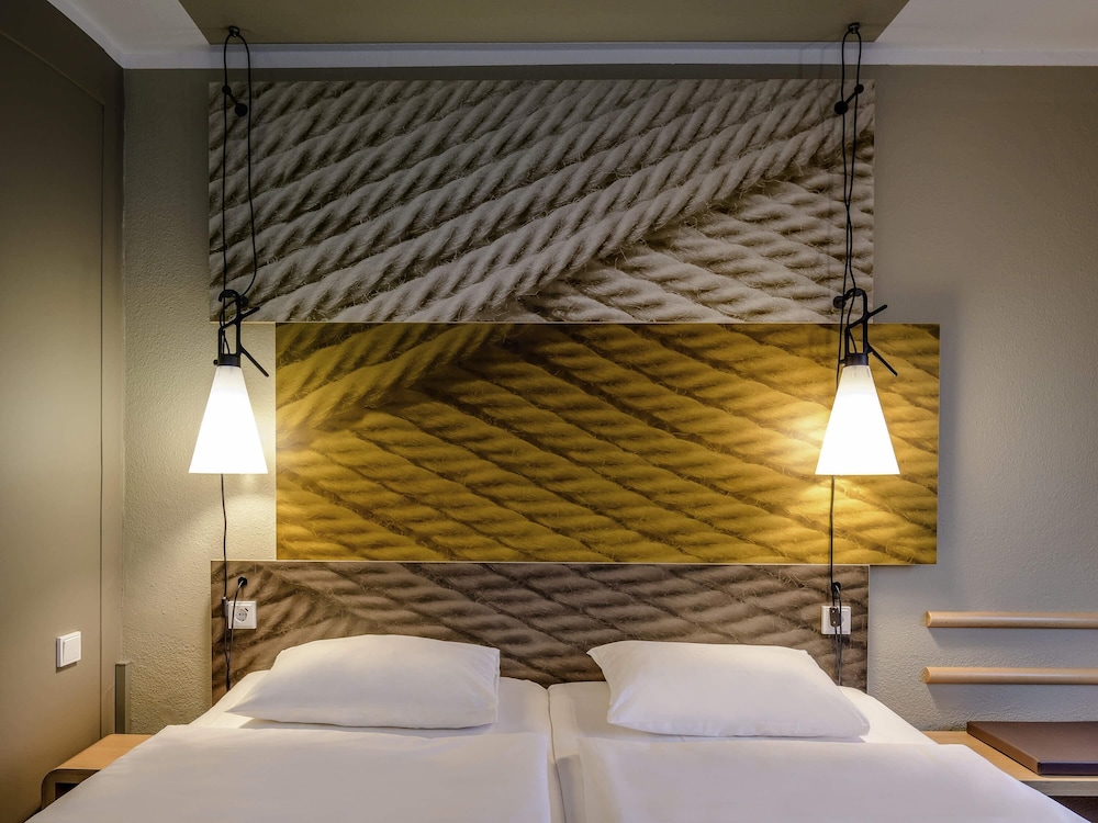 Habitación estándar con camas individuales del hotel Ibis Muenster City. Foto 4