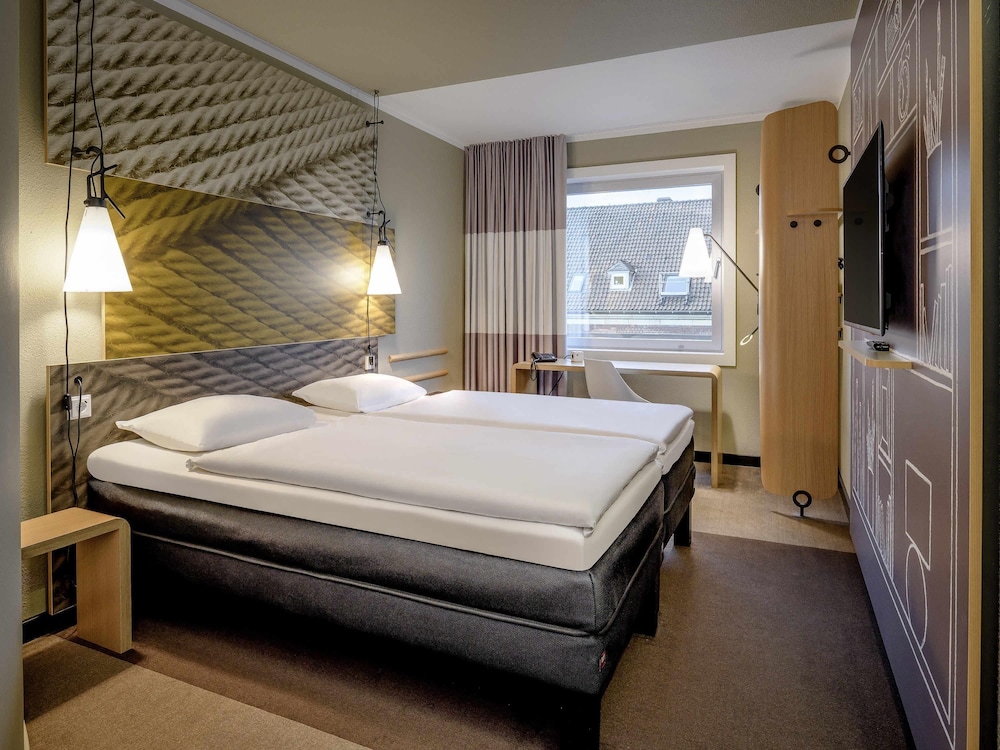 Habitación estándar con camas individuales del hotel Ibis Muenster City. Foto 6