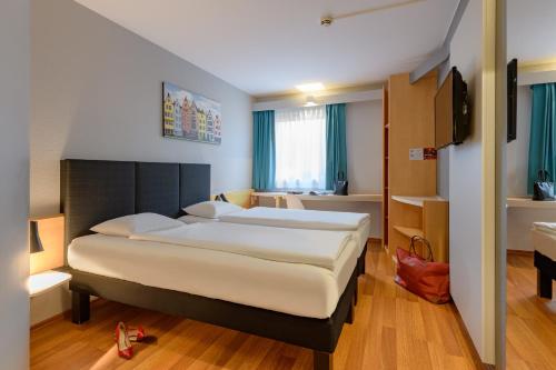 Habitación Doble Estándar - 2 camas del hotel Ibis Köln Frechen. Foto 7