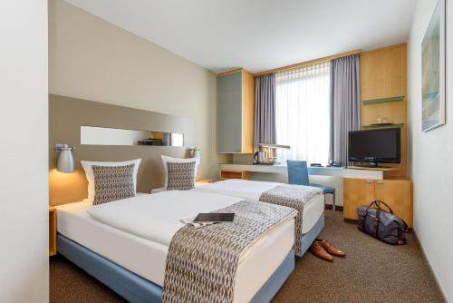 Habitación Doble Estándar - 2 camas del hotel Mercure Düsseldorf City Nord. Foto 3