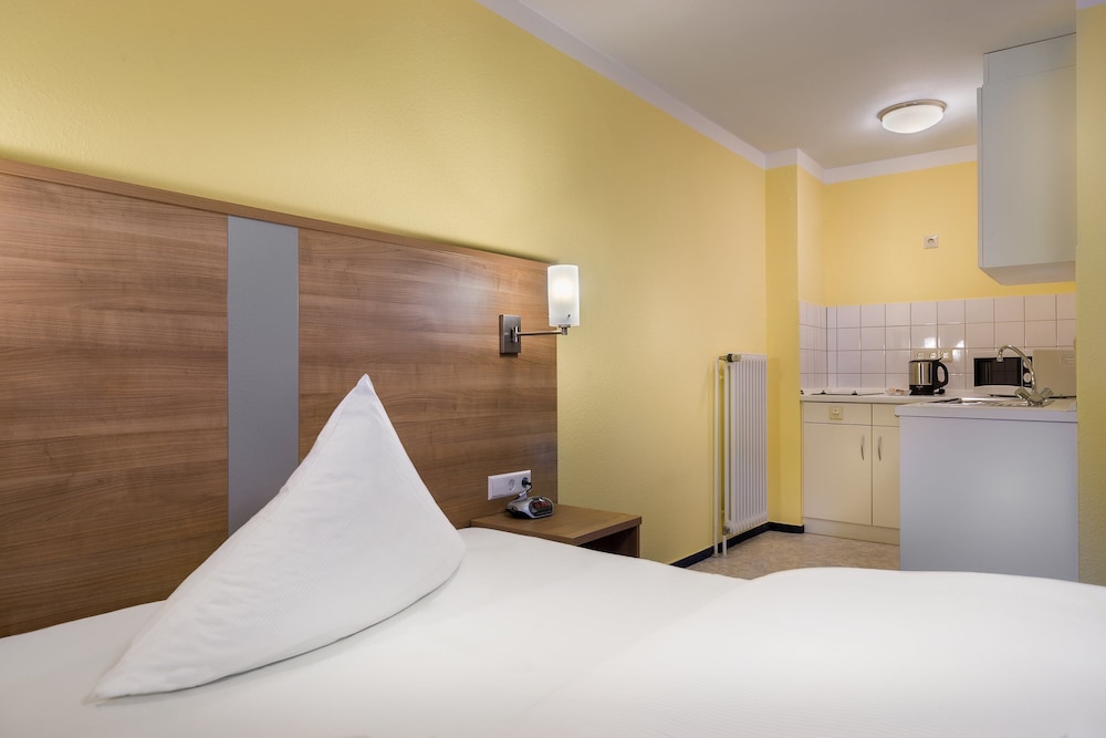 Apartamento Business, 1 cama individual del hotel Acora Karlsruhe Zentrum Living The City. Foto 3