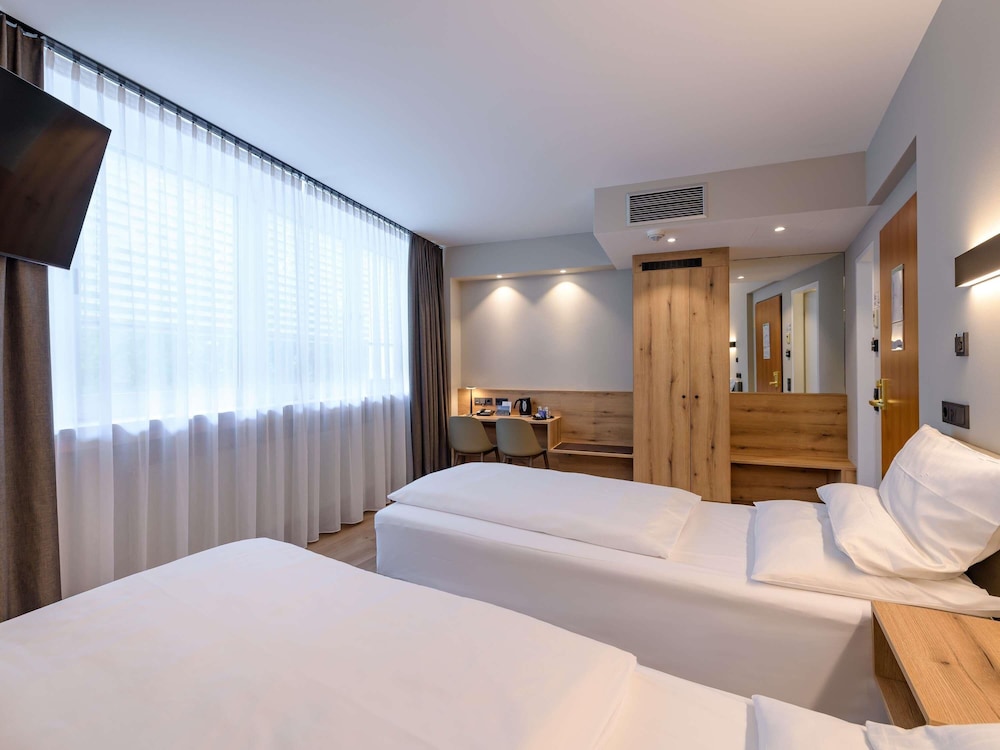 Habitación estándar con dos camas individuales del hotel Mercure München Altstadt. Foto 5