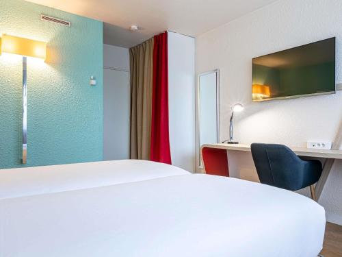 Estudio Superior con Dos Camas Individuales del hotel Mercure Paris Le Bourget. Foto 1